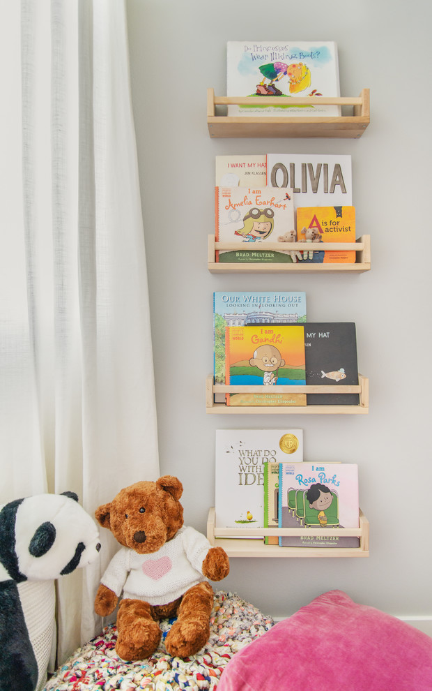 Inspiration for a mid-sized contemporary kids' room for kids 4-10 years old in Seattle with white walls and medium hardwood floors.