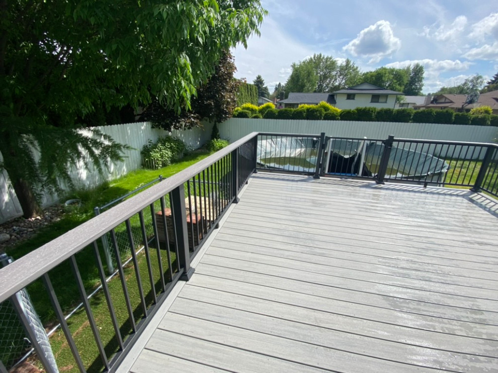 Inspiration for a large backyard metal railing deck remodel in Seattle