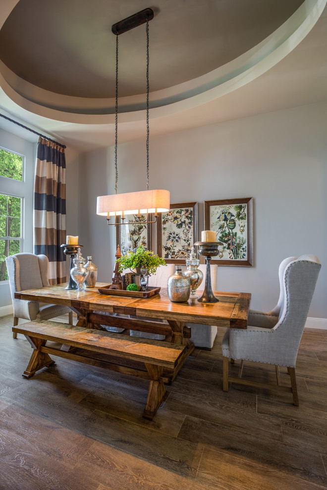 Mid-sized transitional porcelain tile enclosed dining room photo in Phoenix with gray walls