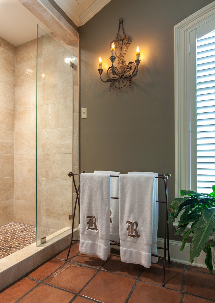 Large traditional bathroom in Dallas with an alcove shower, brown tile, stone tile, brown walls and terra-cotta floors.