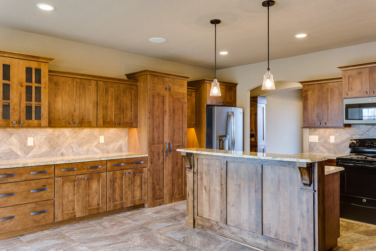 Eat-in kitchen - rustic u-shaped eat-in kitchen idea with shaker cabinets and an island