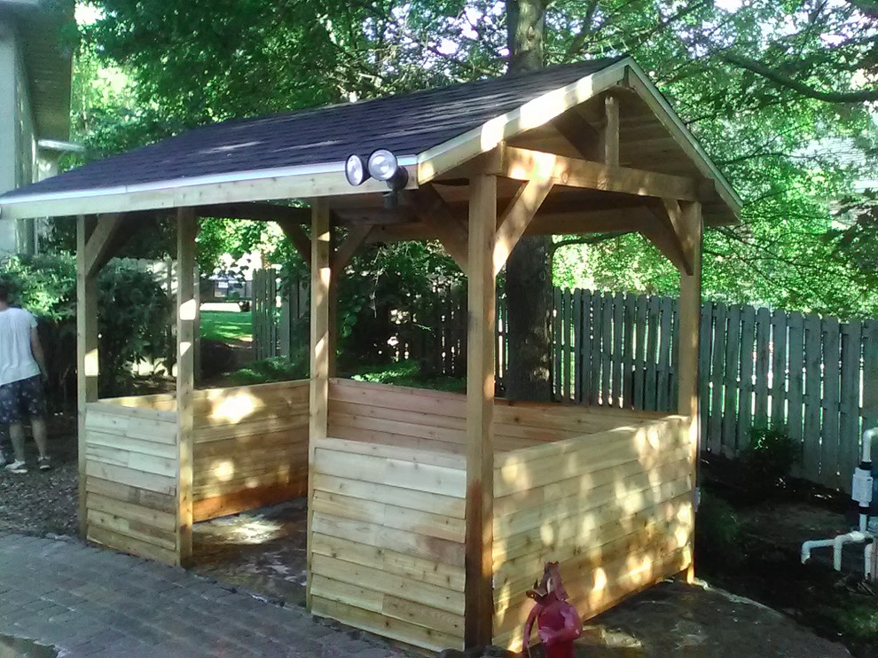 Inspiration for a mid-sized rustic detached shed remodel