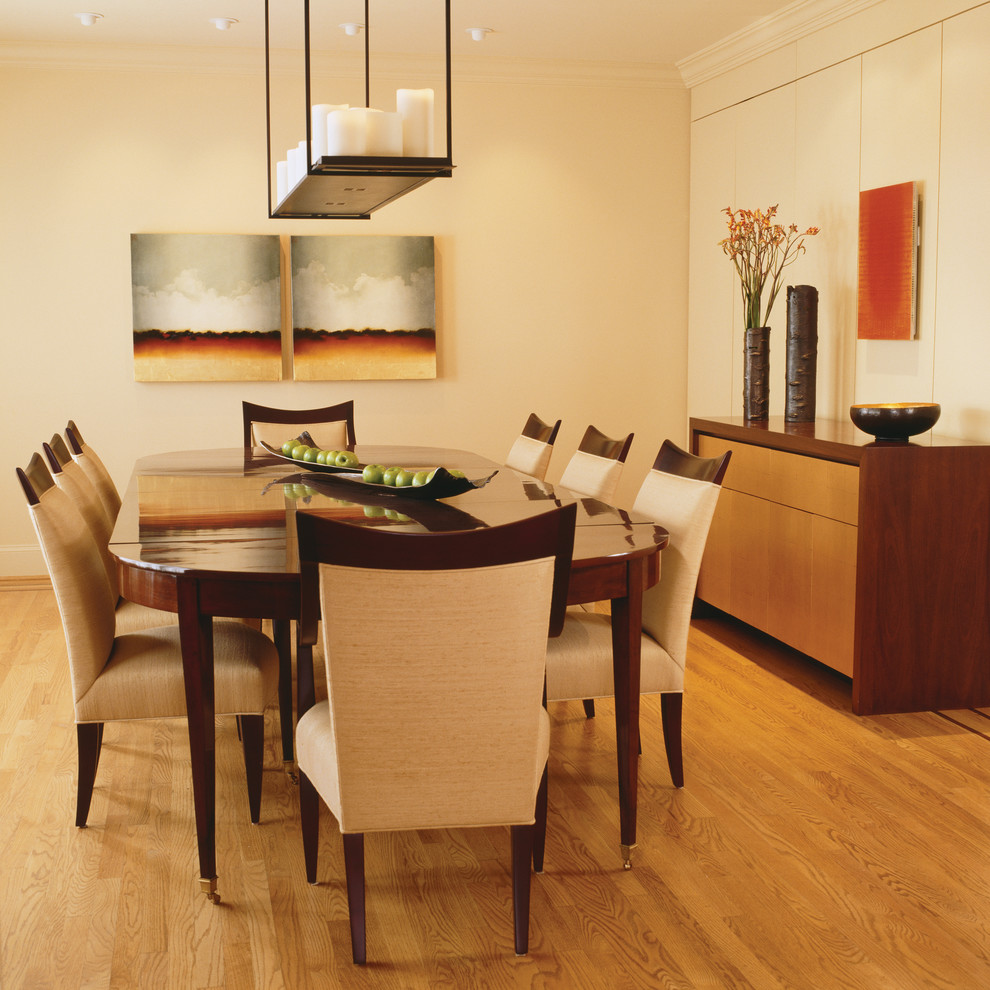 Design ideas for a contemporary dining room in DC Metro with white walls and medium hardwood floors.