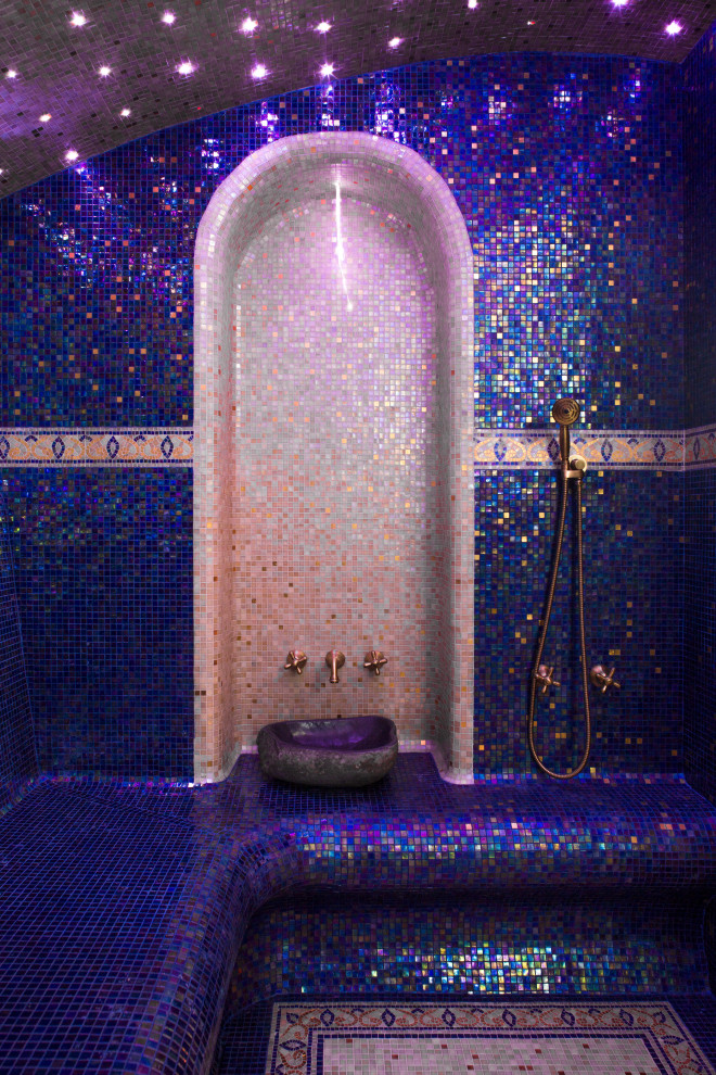 This is an example of a mid-sized mediterranean master bathroom in Other with purple cabinets, blue tile, multi-coloured floor and purple benchtops.