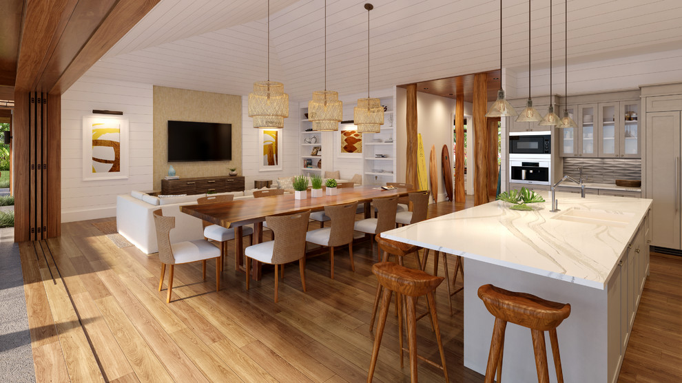 Design ideas for a large beach style l-shaped open plan kitchen in Hawaii with an undermount sink, shaker cabinets, beige cabinets, quartz benchtops, beige splashback, stone tile splashback, panelled appliances, medium hardwood floors, with island and beige benchtop.