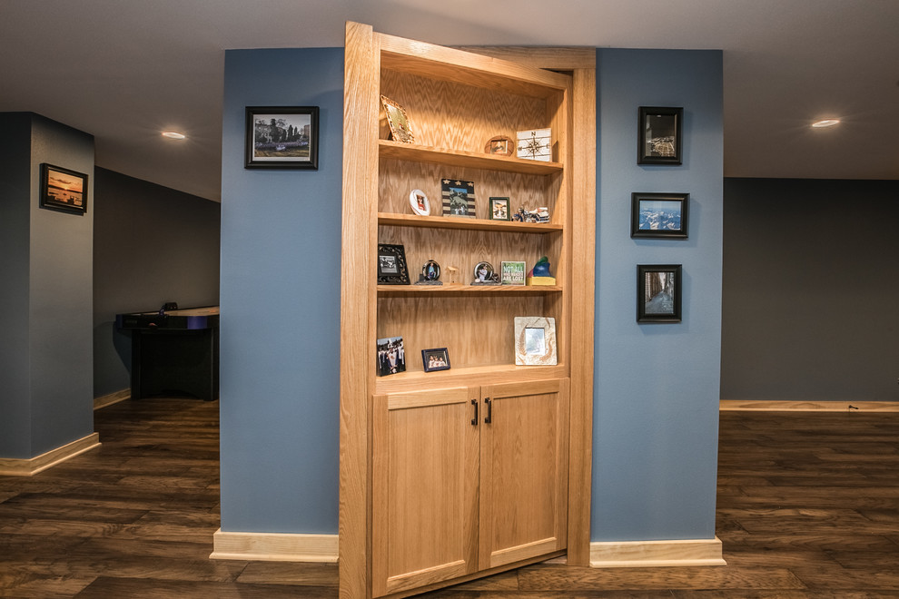 Design ideas for a country basement in Milwaukee with blue walls, medium hardwood floors and brown floor.