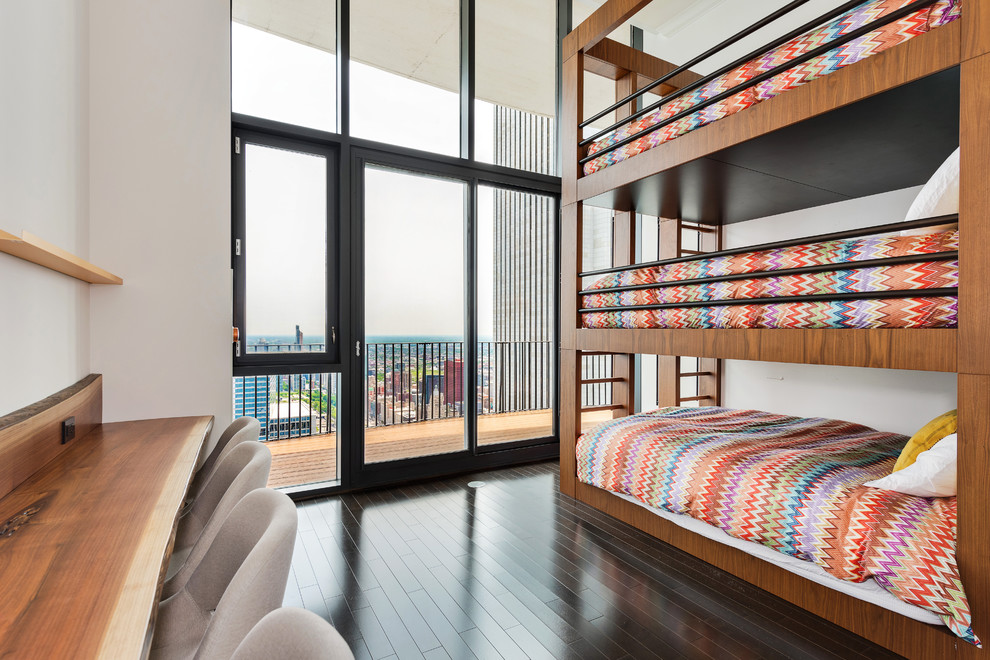Photo of a contemporary kids' bedroom in Chicago with white walls, dark hardwood floors and brown floor.