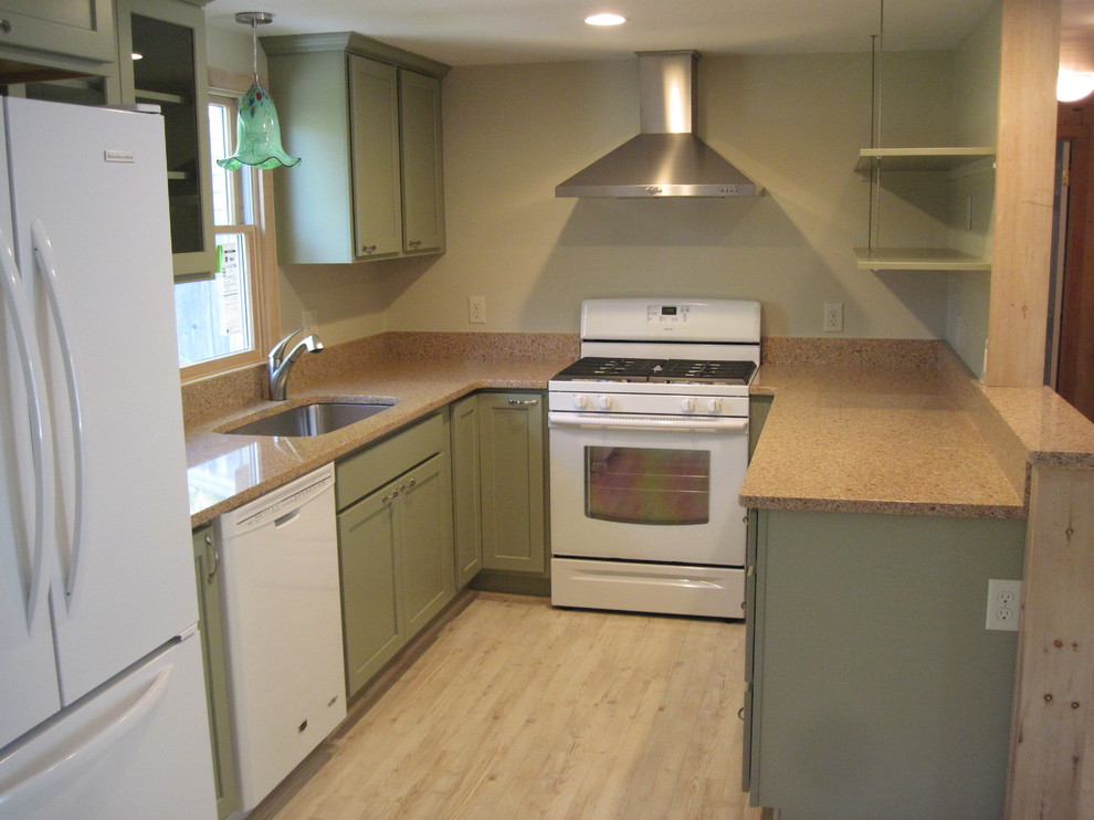 Inspiration for a small beach style u-shaped kitchen in Boston with an undermount sink, flat-panel cabinets, green cabinets, quartz benchtops and stainless steel appliances.