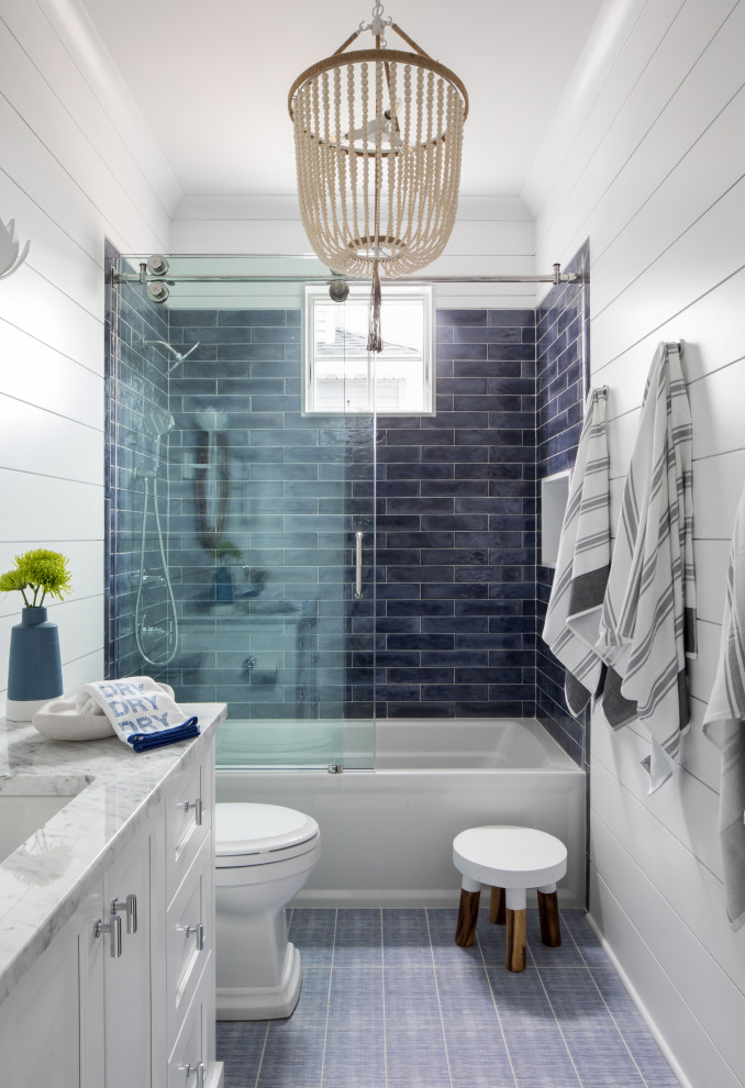 Example of a beach style home design design in New York