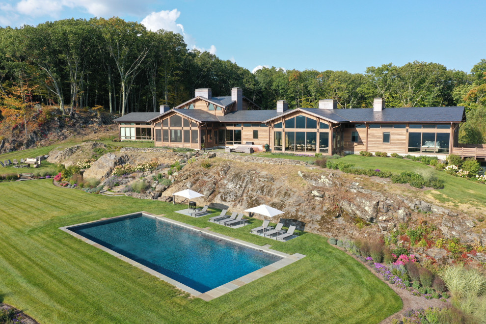 This is an example of a large country backyard rectangular pool in New York.