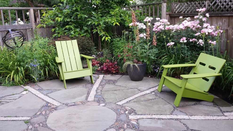 Inspiration for a small country backyard full sun garden in Portland with natural stone pavers.