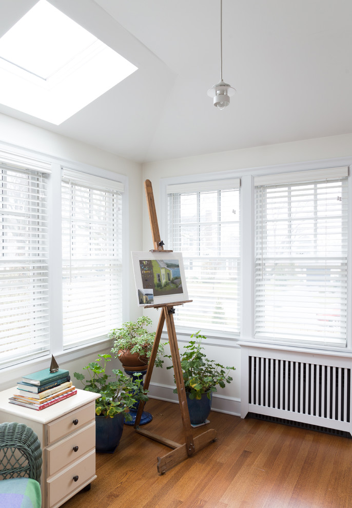 Small transitional sunroom in San Diego with medium hardwood floors and a standard ceiling.