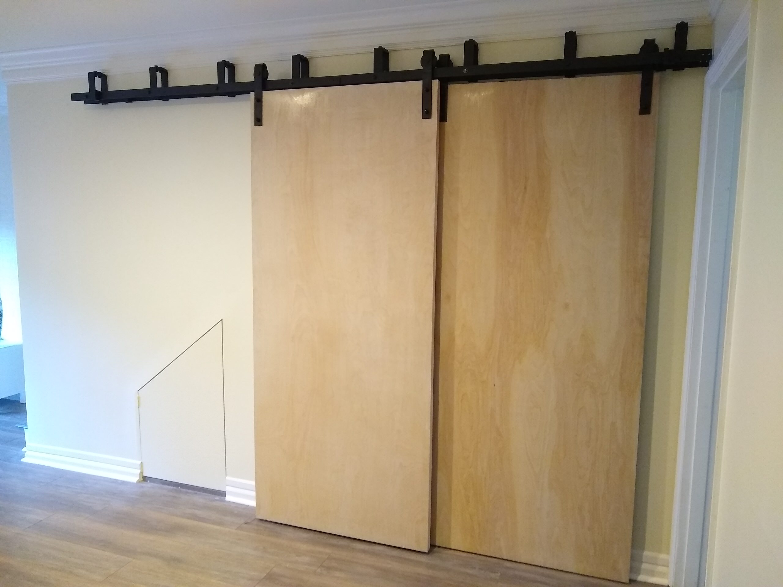 Build Closet with Sliding Barn Doors Under Stairway