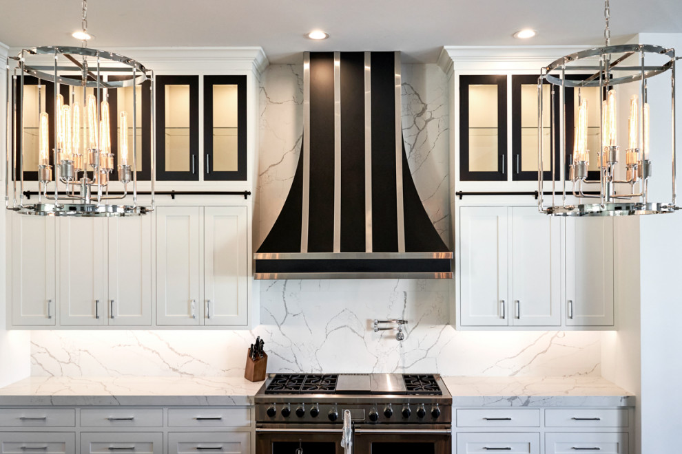 Example of a transitional kitchen design in Phoenix with shaker cabinets and white cabinets