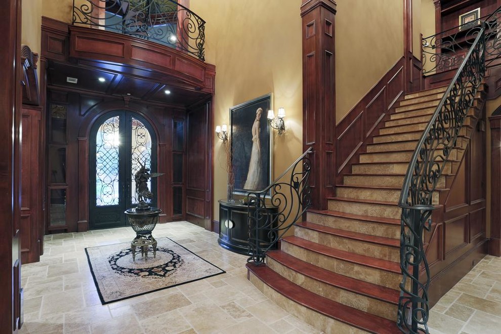 Large traditional foyer in Houston with beige walls, ceramic floors, a double front door and a glass front door.