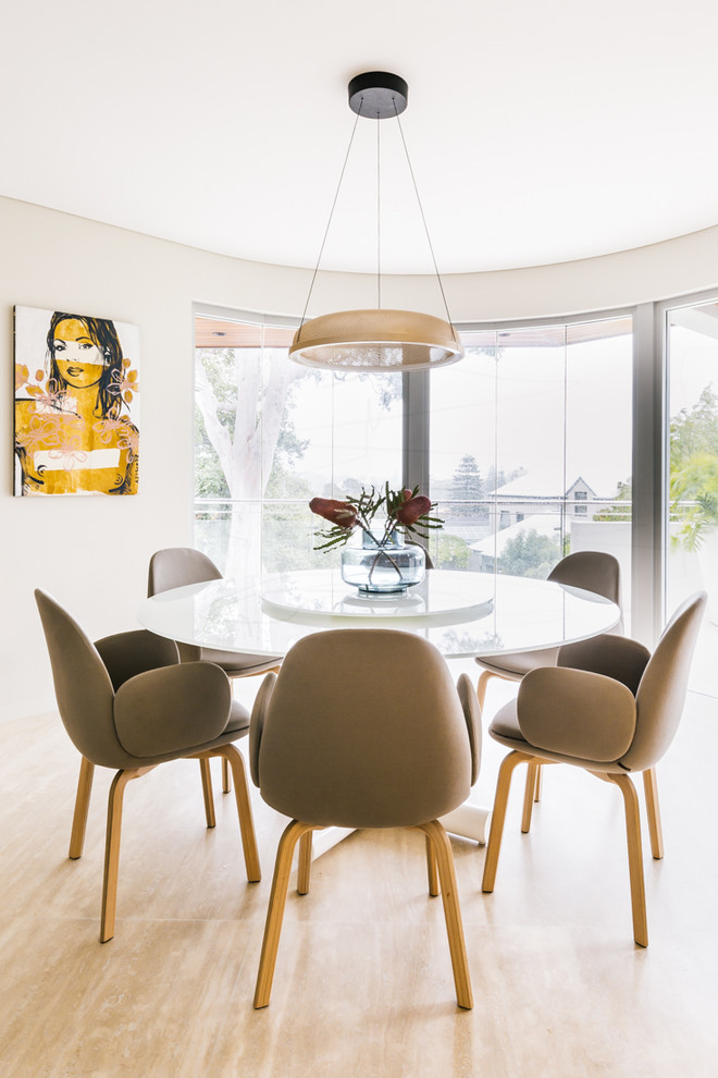 Design ideas for a contemporary dining room in Perth with white walls and beige floor.