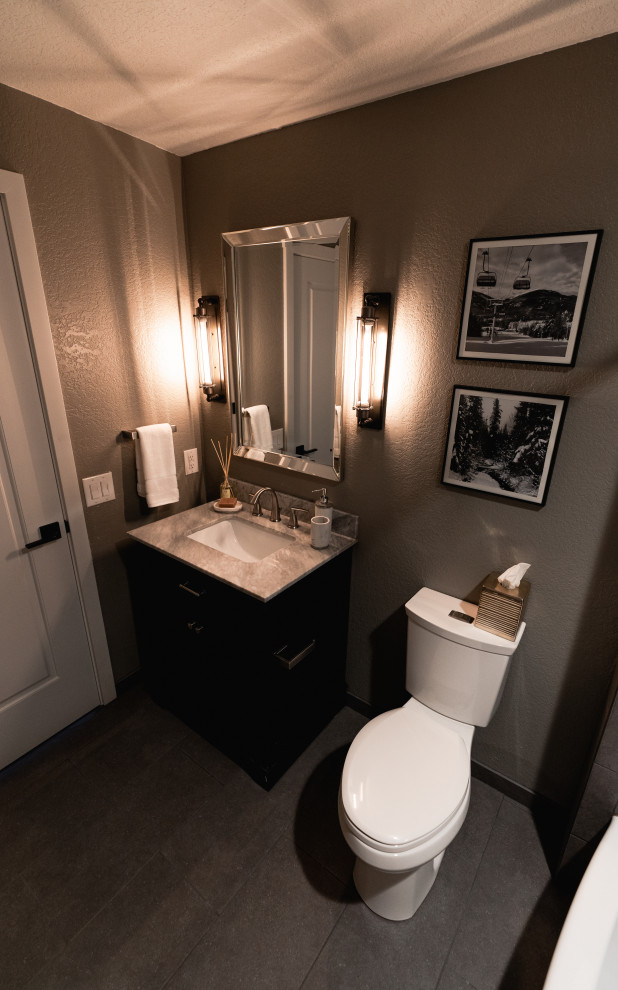 Small transitional bathroom in Seattle with shaker cabinets, dark wood cabinets, an alcove shower, porcelain tile, engineered quartz benchtops, a shower curtain, a single vanity and a freestanding vanity.