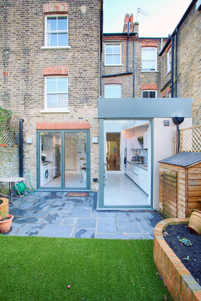 This is an example of a contemporary three-storey brick exterior in London.