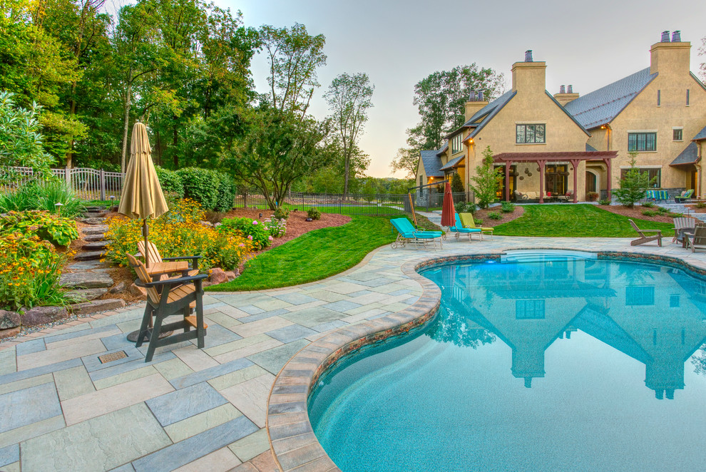 Inspiration for a mid-sized transitional backyard tile and kidney-shaped pool house remodel