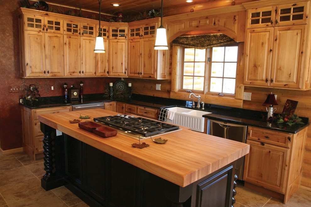 This is an example of a mid-sized country l-shaped open plan kitchen in Austin with a farmhouse sink, raised-panel cabinets, medium wood cabinets, granite benchtops, brown splashback, stainless steel appliances, porcelain floors and with island.