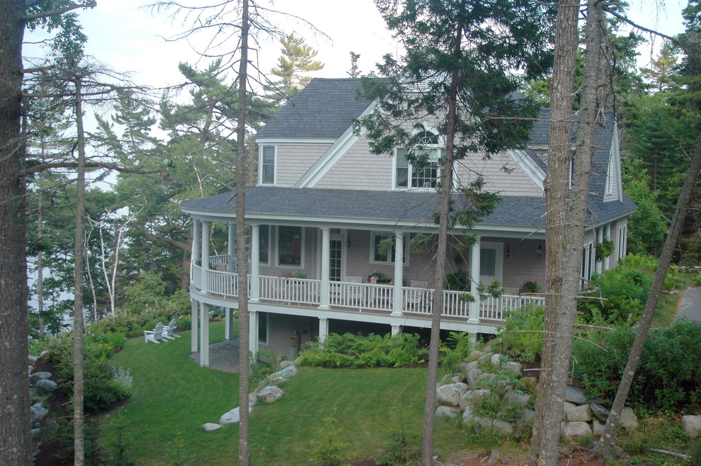 Inspiration for a beach style two-storey exterior in Portland Maine with wood siding.