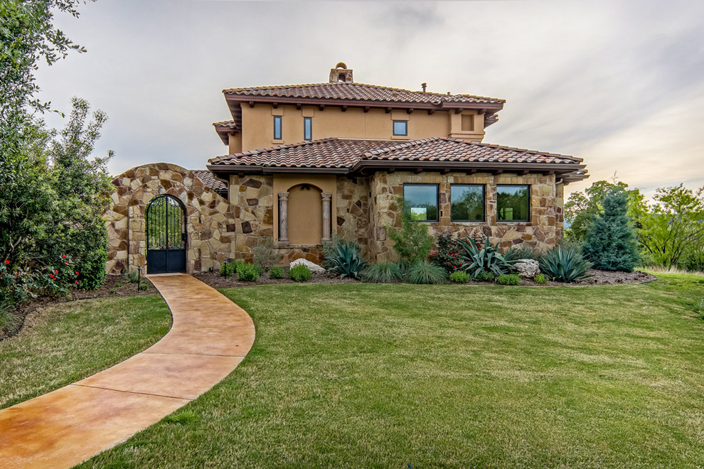 This is an example of a mediterranean entryway in Austin.