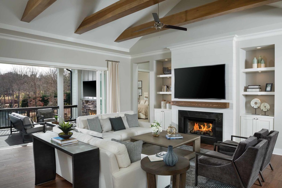 Inspiration for a beach style open concept family room in Other with a stone fireplace surround, a wall-mounted tv, grey walls, dark hardwood floors and a ribbon fireplace.