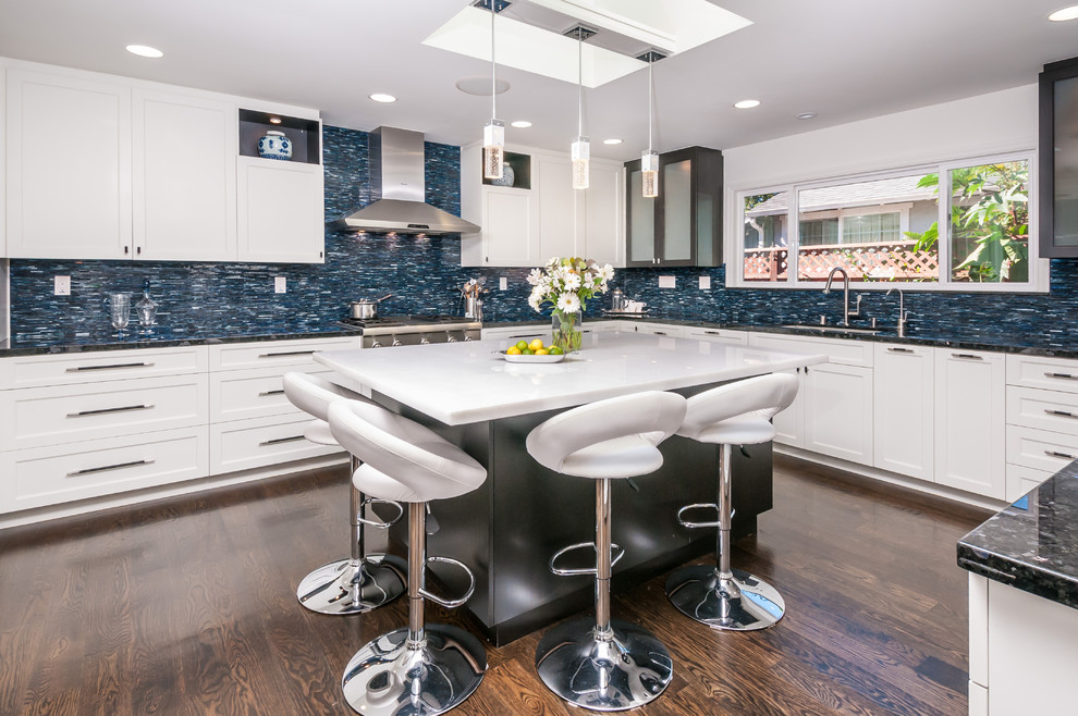 Inspiration for a contemporary kitchen in San Francisco with shaker cabinets, white cabinets, blue splashback, matchstick tile splashback and stainless steel appliances.
