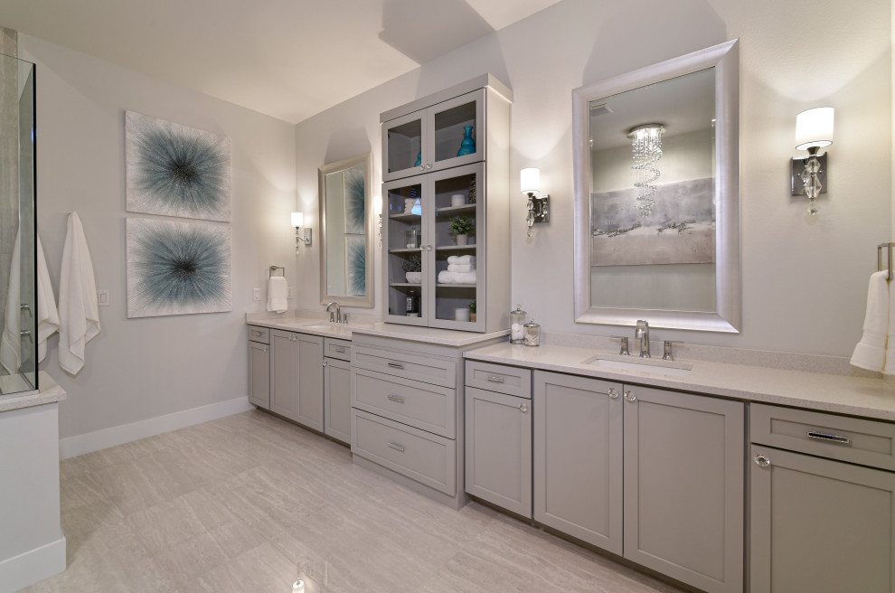 Inspiration for a mid-sized transitional master gray tile and porcelain tile porcelain tile, white floor and double-sink freestanding bathtub remodel with shaker cabinets, gray cabinets, a two-piece toilet, gray walls, an undermount sink, quartz countertops, white countertops and a built-in vanity