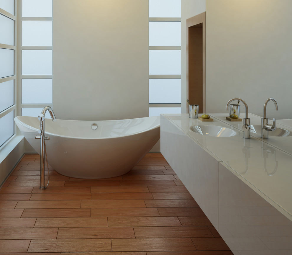 Mid-sized modern master bathroom in Sydney with flat-panel cabinets, white cabinets, a freestanding tub, an open shower, a wall-mount toilet, ceramic tile, white walls, ceramic floors, an integrated sink, solid surface benchtops, white tile, brown floor, an open shower and white benchtops.