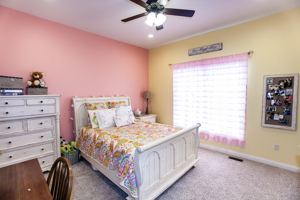 Design ideas for a mid-sized arts and crafts guest bedroom in St Louis with pink walls and carpet.