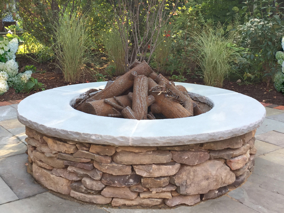 Fieldstone Fire Pit With Artisan Crafted Steel Logs American