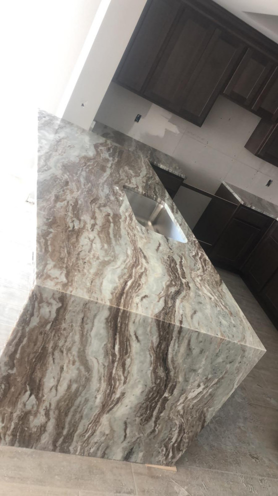 Kitchen - kitchen idea with granite countertops and multicolored countertops
