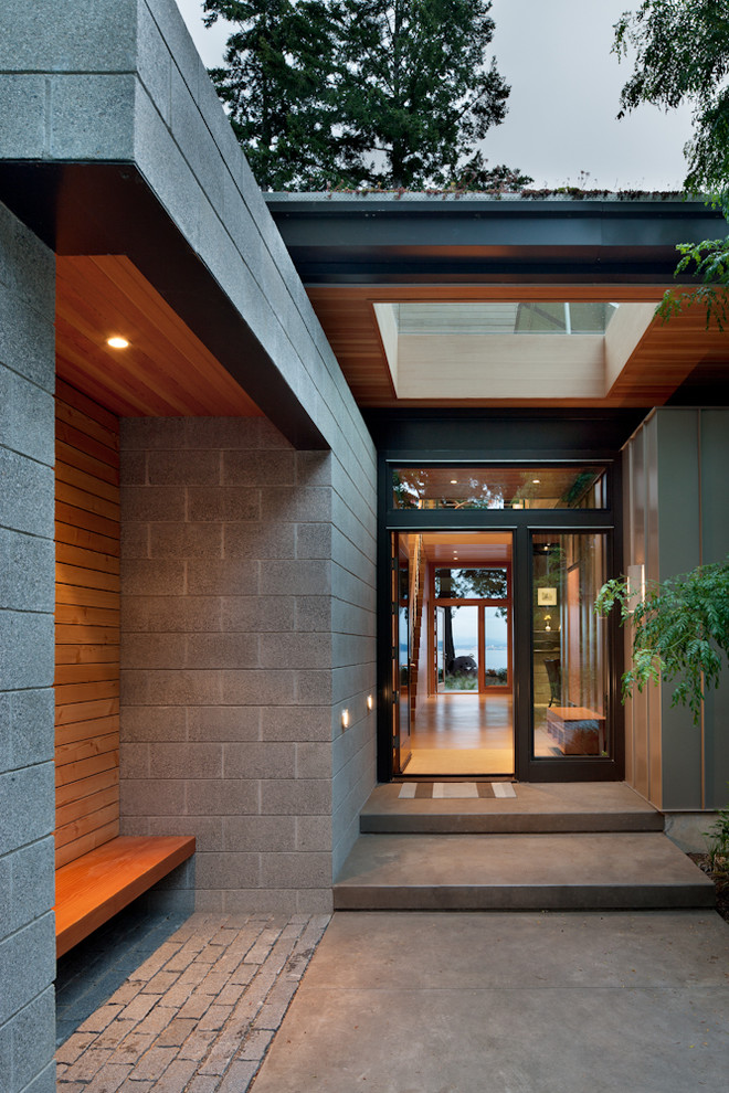 Design ideas for a mid-sized contemporary entryway in Seattle with a glass front door and a single front door.