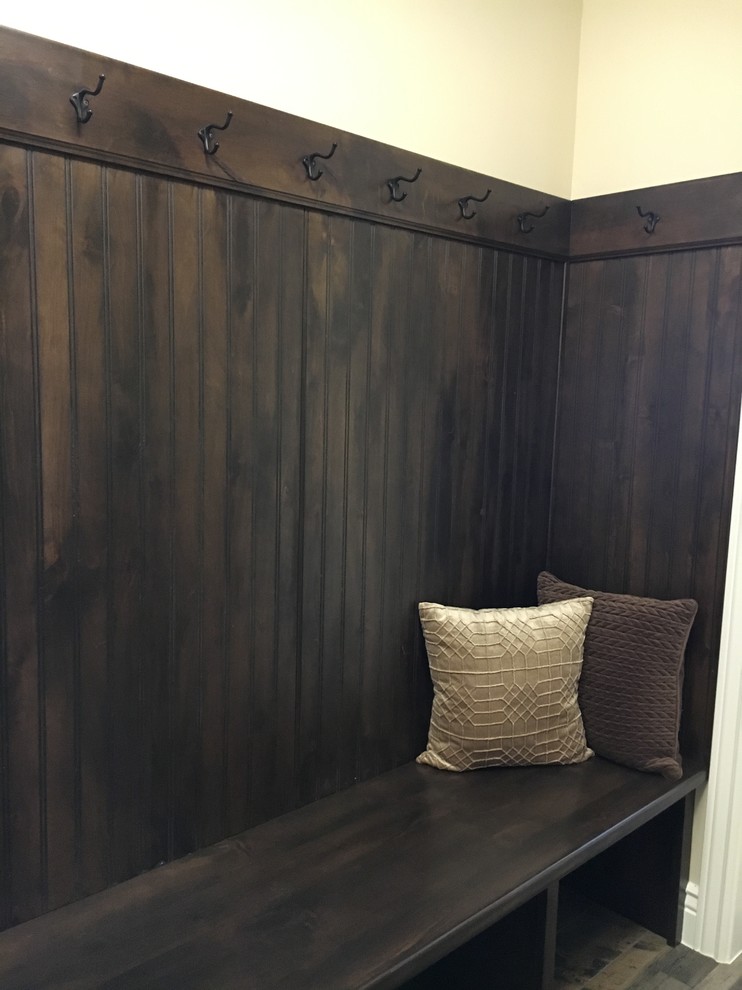Mudroom - mid-sized transitional porcelain tile mudroom idea with beige walls