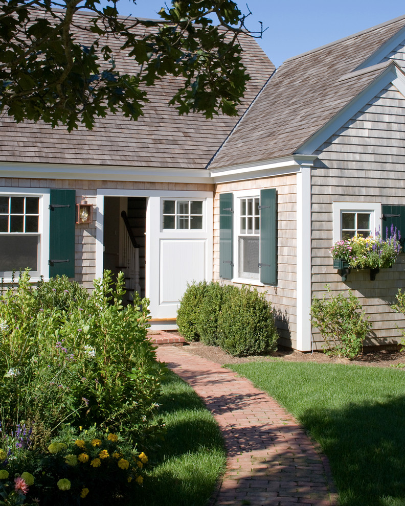 Photo of a mid-sized beach style front door in Boston with a single front door.