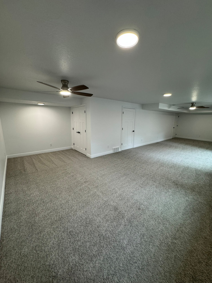 Basement great room finish, ceiling fans and 8" ceiling light with halo rings.