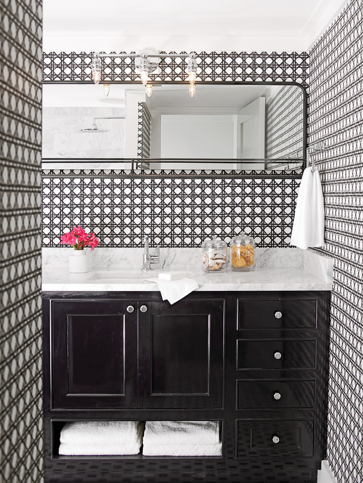 This is an example of a small eclectic master bathroom in Miami with recessed-panel cabinets, black cabinets, multi-coloured walls, ceramic floors, an undermount sink and marble benchtops.