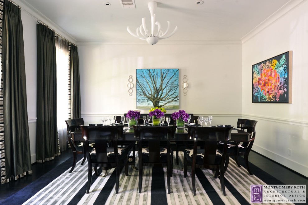 This is an example of a large contemporary separate dining room in Houston with white walls, dark hardwood floors and no fireplace.