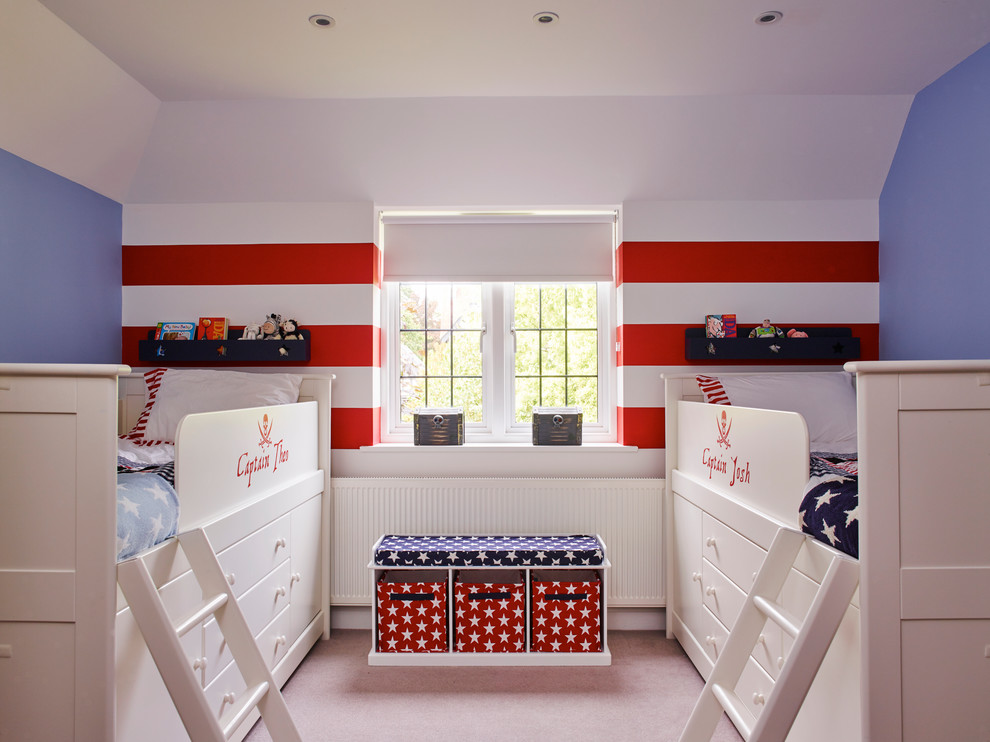 Transitional kids' bedroom in Surrey with multi-coloured walls and carpet for boys.