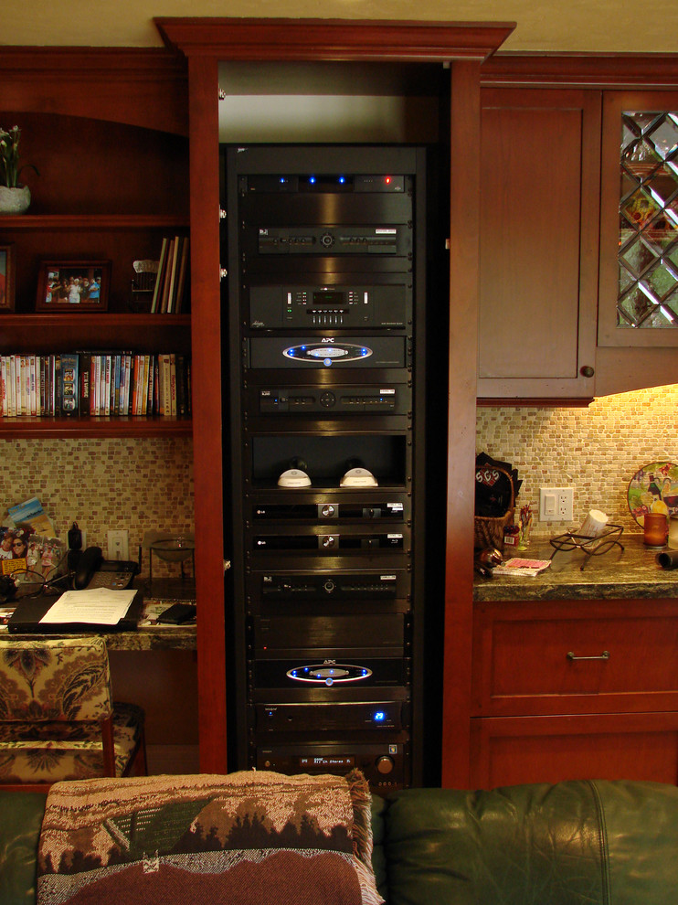 Family room - traditional light wood floor family room idea in Orange County with beige walls and a wall-mounted tv