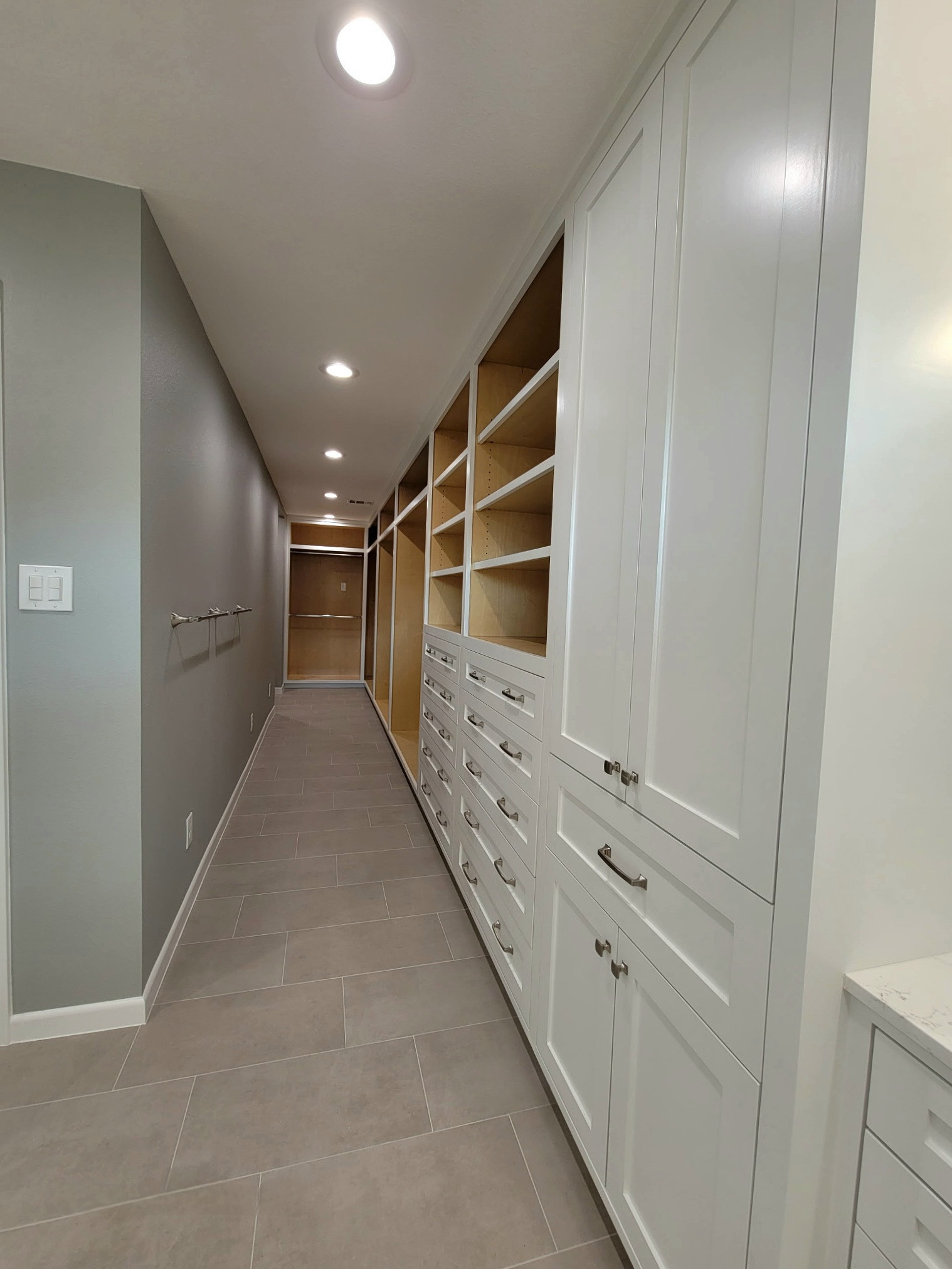 Two separate bathrooms converted into a master bathroom with a big open closet