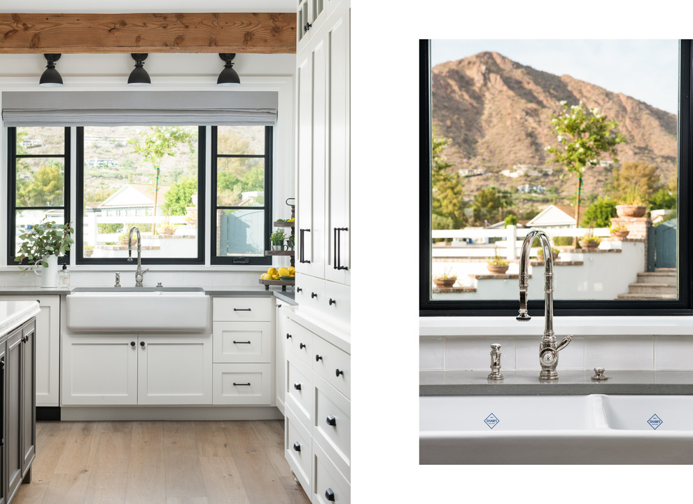 Design ideas for a large traditional u-shaped open plan kitchen in Phoenix with a farmhouse sink, shaker cabinets, white cabinets, quartz benchtops, panelled appliances, with island and grey benchtop.