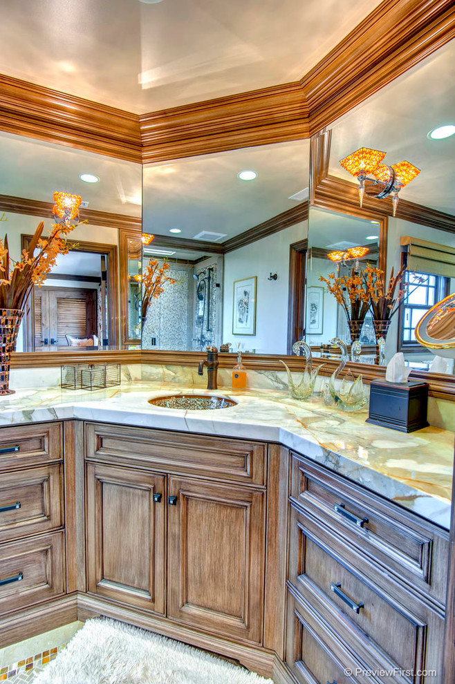 Photo of an arts and crafts bathroom in Orange County with medium wood cabinets.