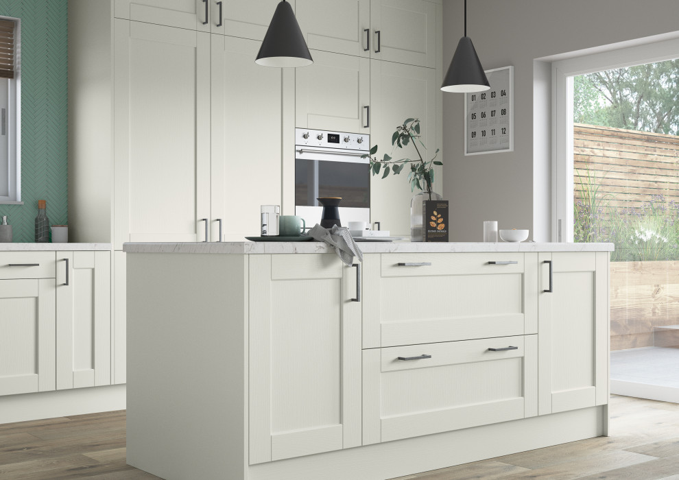Inspiration for a small contemporary l-shaped kitchen/diner in Other with a submerged sink, shaker cabinets, white cabinets, quartz worktops, green splashback, stainless steel appliances, an island and white worktops.