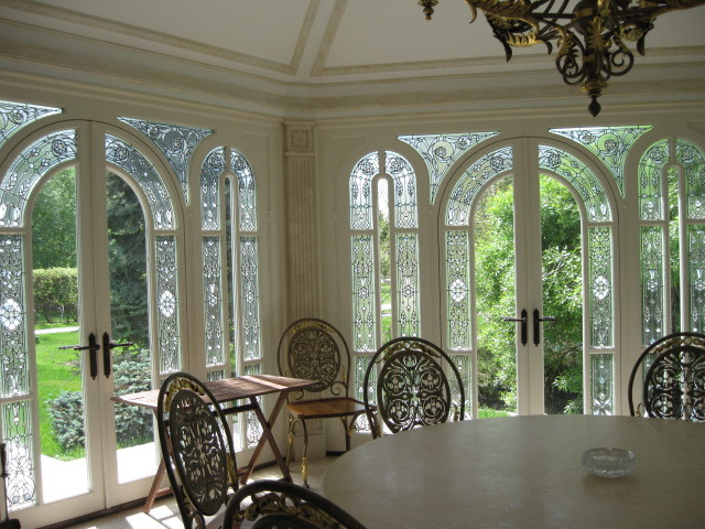 Photo of a transitional sunroom in Paris.