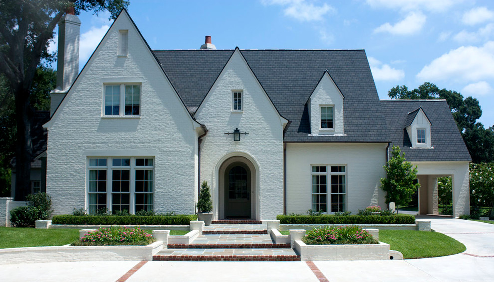 Photo of a traditional brick exterior in New Orleans with a gable roof.
