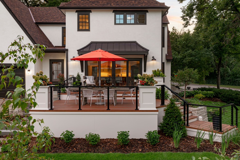 Diseño de terraza planta baja vintage de tamaño medio en patio lateral y anexo de casas con barandilla de cable