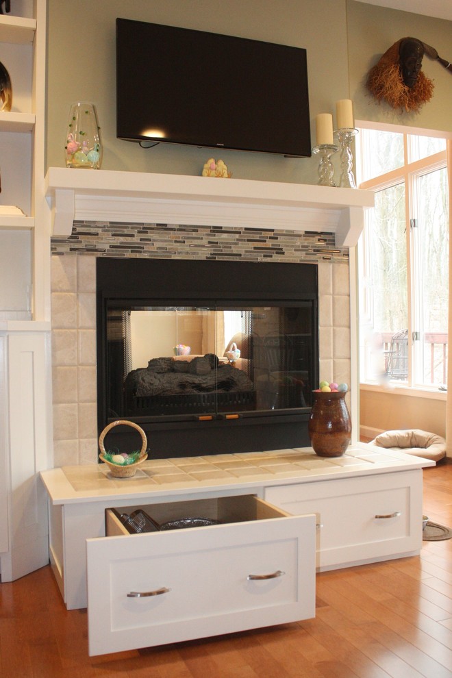 Mid-sized transitional open concept light wood floor home design photo with red walls, a standard fireplace and a tile fireplace
