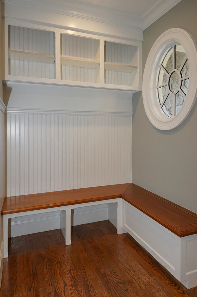 Mudroom - large transitional dark wood floor mudroom idea in Boston with gray walls and a dark wood front door